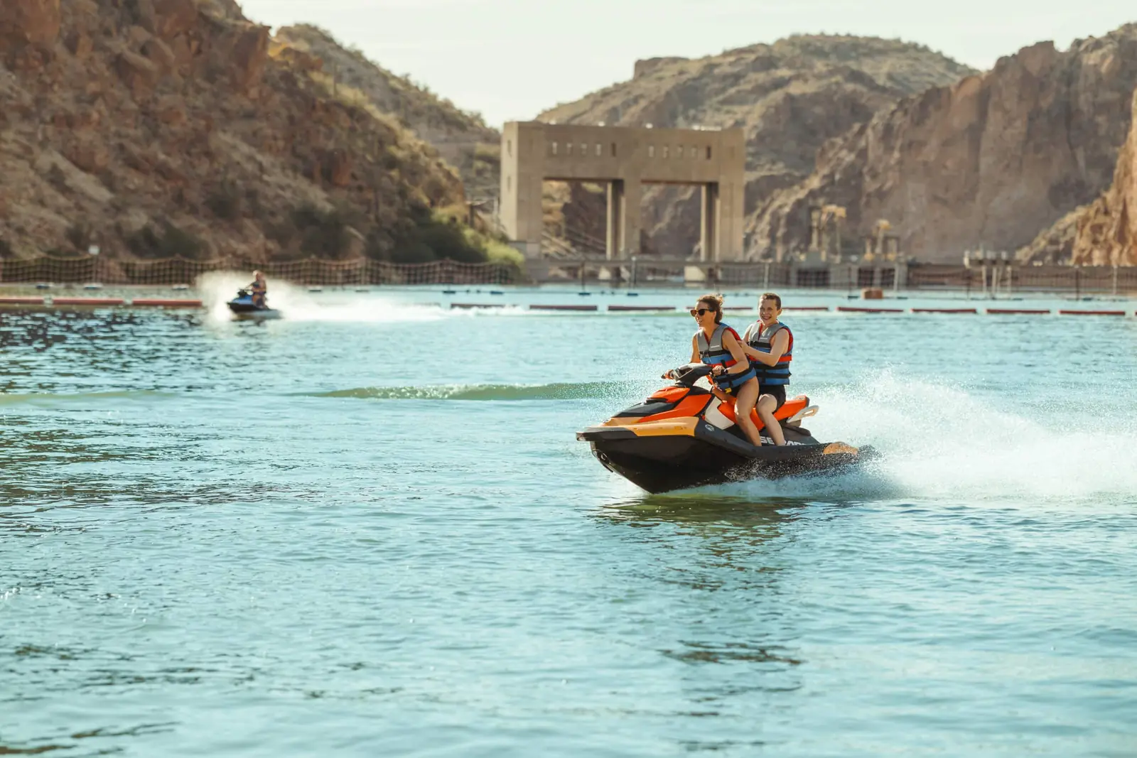 Sea-Doo Spark 3up jet ski on crystal-clear Canyon Lake with dramatic 1000-foot canyon walls and Superstition Mountains scenery