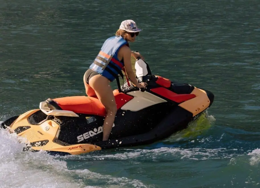 Rider leaning into a turn on a Sea-Doo Spark jet ski rental